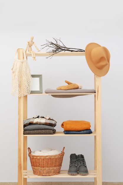 Photo wooden shelving with clothes autumn season clothes