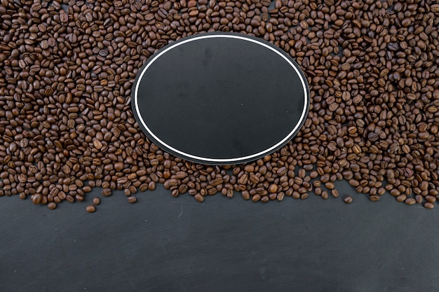 Wooden sign and beans on wooden table background