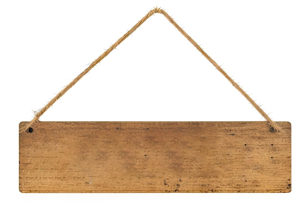 Wooden sign hanging from a rusty nail