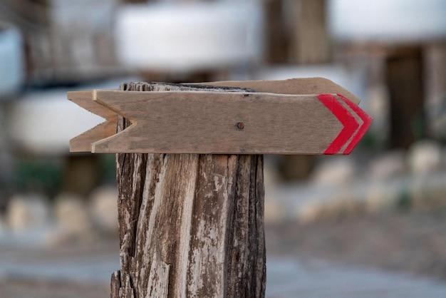 Wooden sign this way on the beach