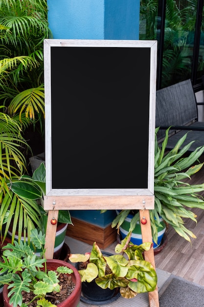 Wooden signboard in green floral garden