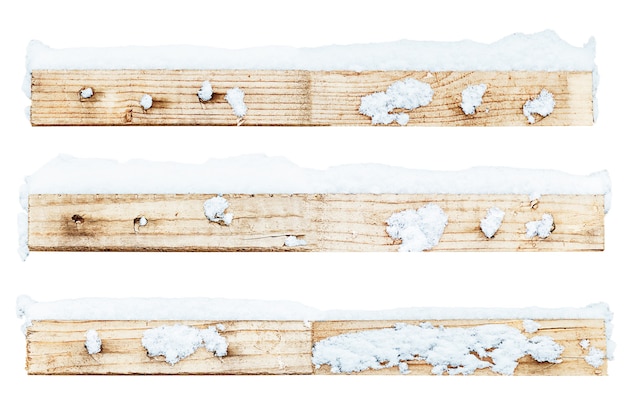 Wooden slats with snow are isolated on a white background