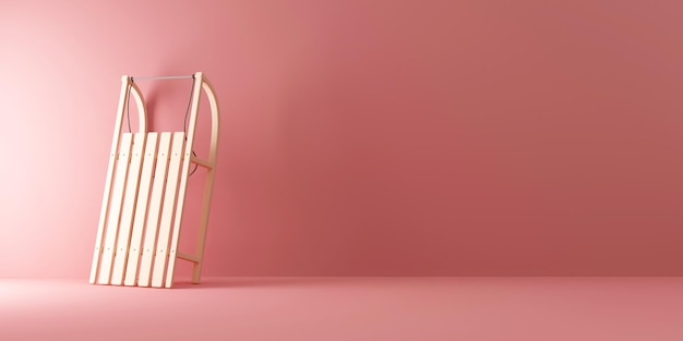 Photo wooden sled near the wall on pink studio background