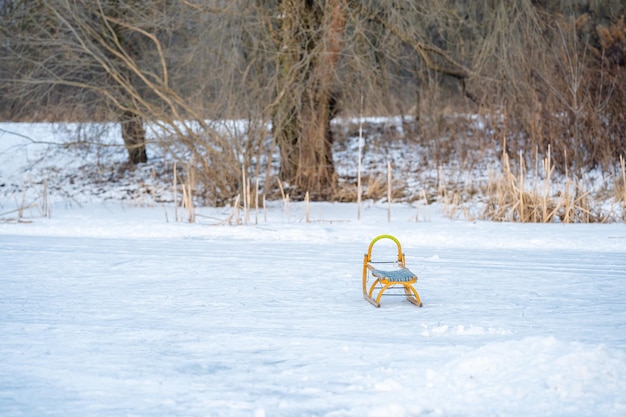 Wooden sleds on ice on a winter frozen lake