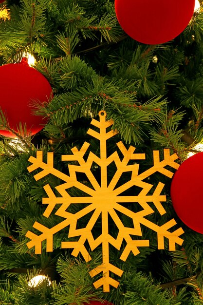 Wooden snowflake ornament in a tree