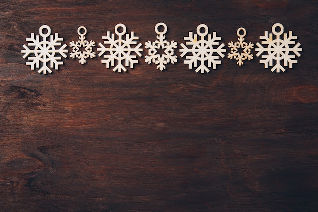 Wooden snowflakes on a dark background