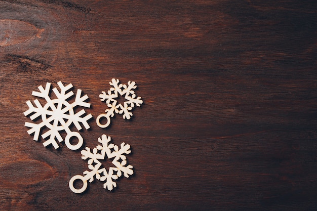 Wooden snowflakes on a dark background