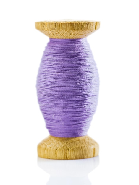 Photo wooden spool with thread