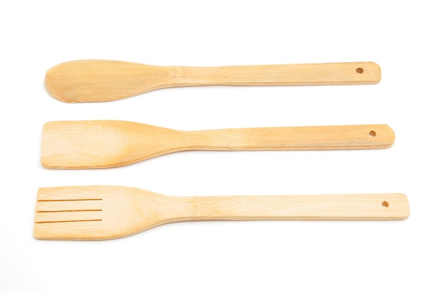 Wooden spoon, fork and spatula kitchen utensils for cooking food isolated