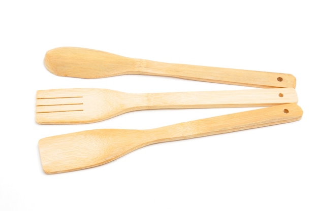 Wooden spoon, fork and spatula kitchen utensils for cooking food isolated