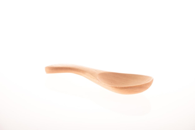 Wooden spoon isolated on white background