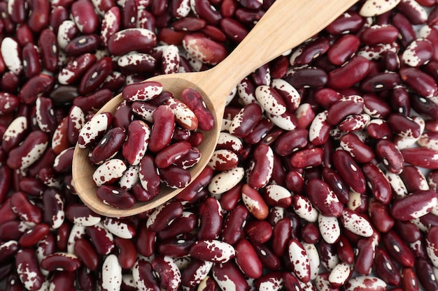 Wooden spoon on kidney beans top view