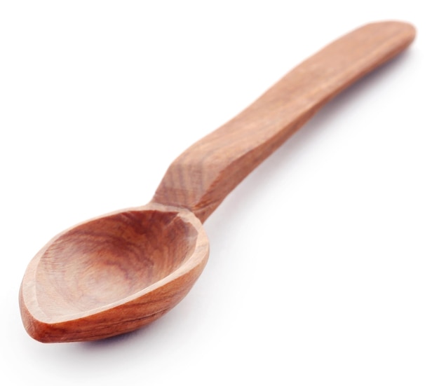 Wooden spoon over white background