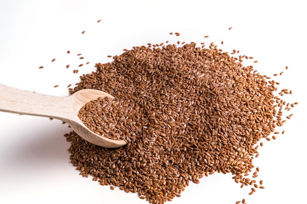 Wooden spoon with brown Flax seeds