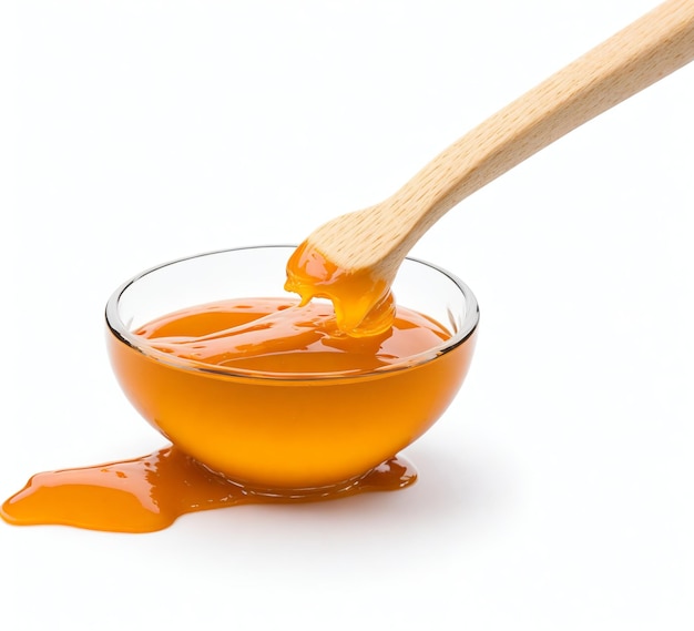 Wooden Spoon with Caramel in Glass Bowl