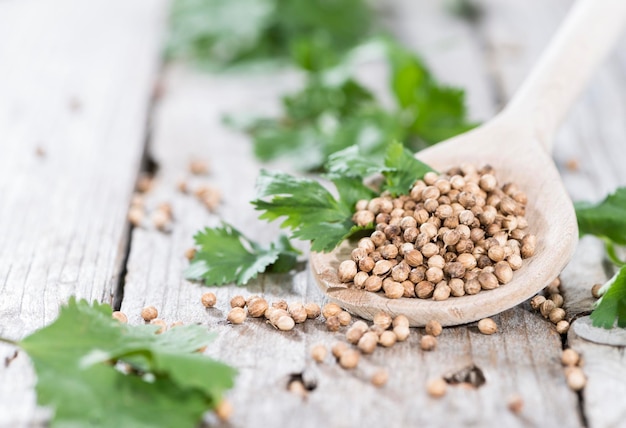 wooden spoon with coriander seeds