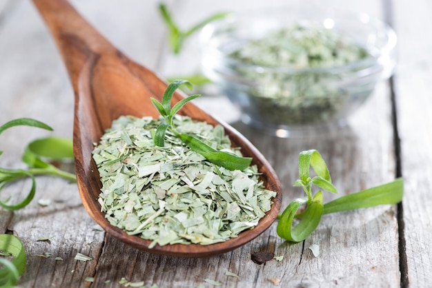 Wooden spoon with dried Tarragon