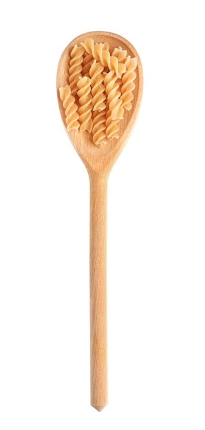 Foto cucchiaio di legno con pasta cruda