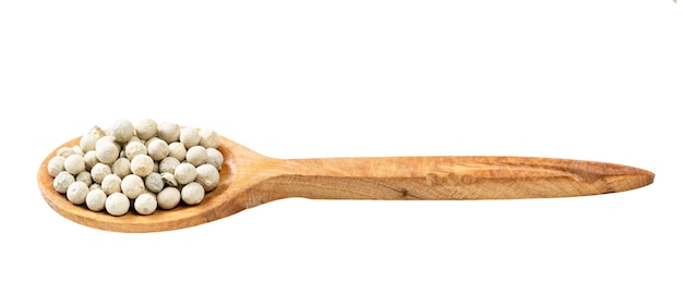 Wooden spoon with white pepper peppercorns