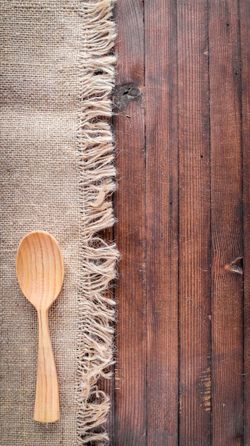 Wooden spoon On Wooden background Top view