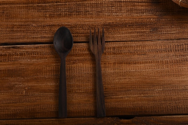 Wooden spoon on wooden background