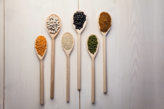 Wooden spoons of pulses and seeds