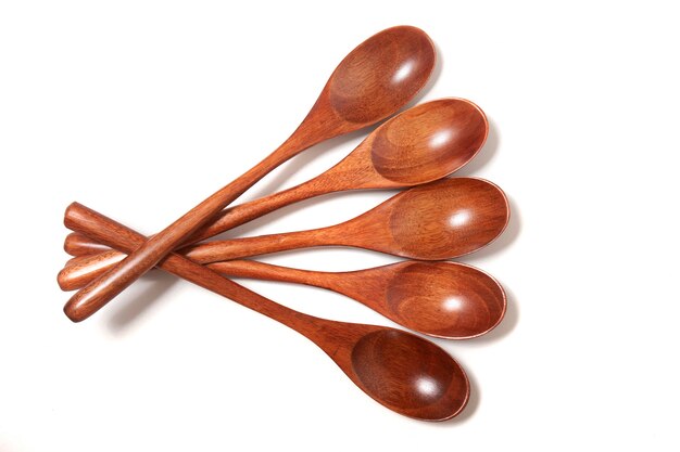 Wooden spoons over white background