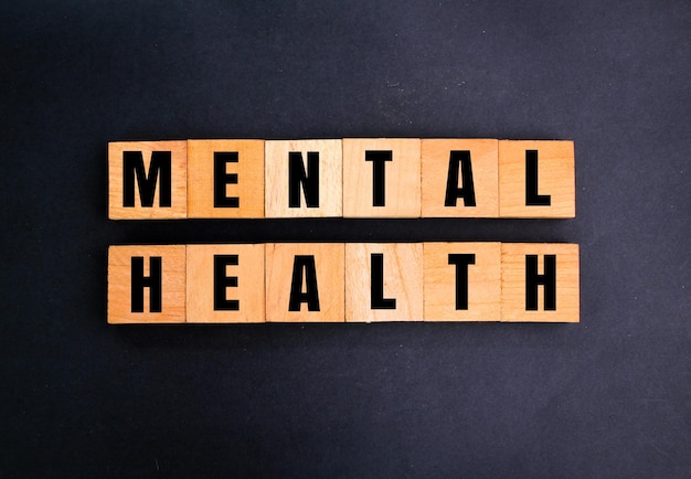 wooden square with the word mental health mental health concept