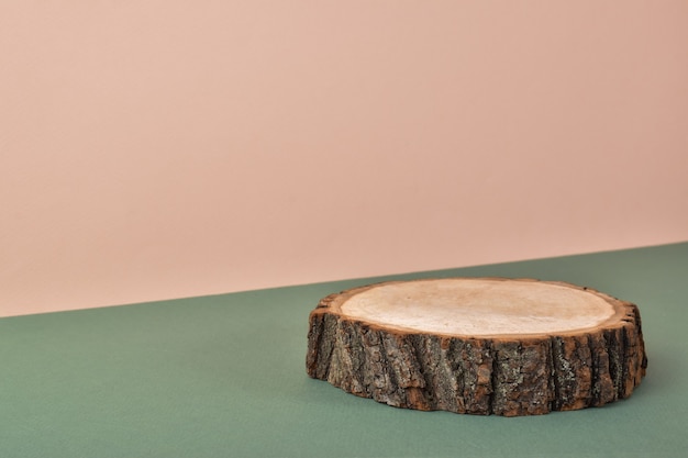 Wooden stage on a natural background. Minimalistic branding scene.