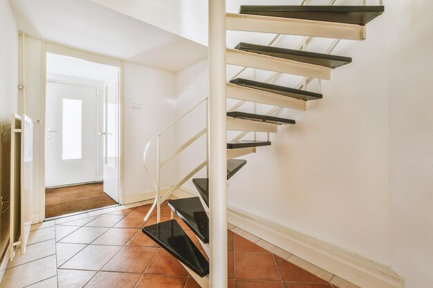 Wooden staircase in spacious hall of apartment