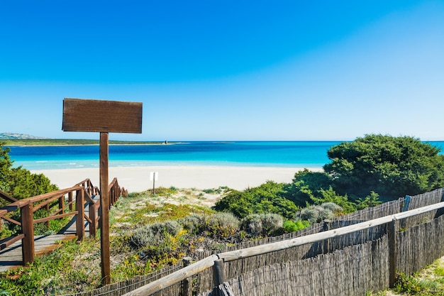 Wooden stairway to the beach in Sardinia Italy