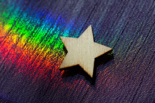 Photo wooden star shape on colorful fabric