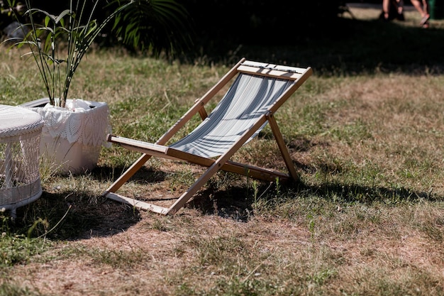 Wooden sunbed on garden