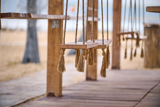 Wooden swing on a beach bar closeup