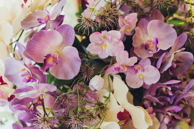 wooden swing decorated with artificial flowers.