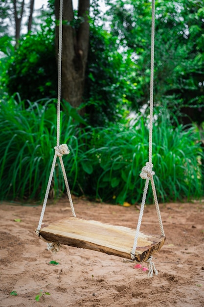 wooden swing in garden