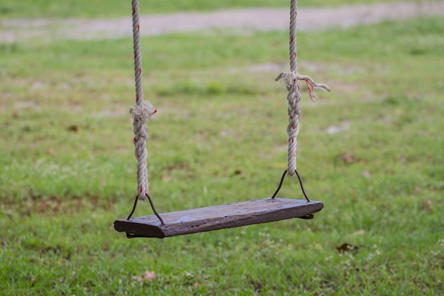 Wooden swing in the garden