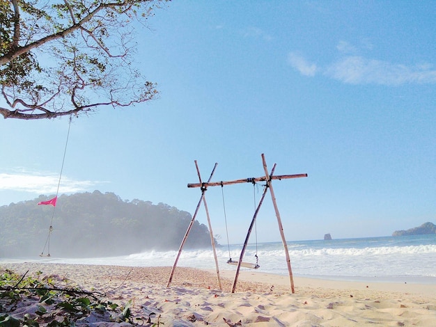 Wooden swing on seaside
