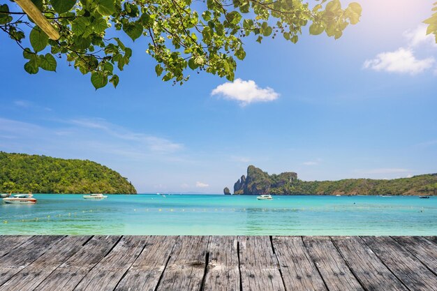 Wooden table against the sea shore background