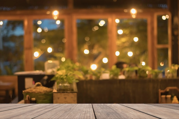 Wooden table blank in front of blurred restaurant background