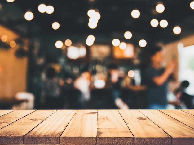 wooden table in front of blurred restaurant