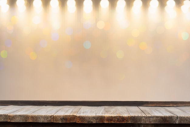 wooden table in front of decorative indoor string lights.