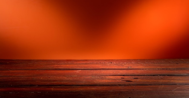 Wooden table in front of rustic wall with empty copy space