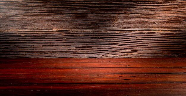 Wooden table in front of rustic wall with empty copy space