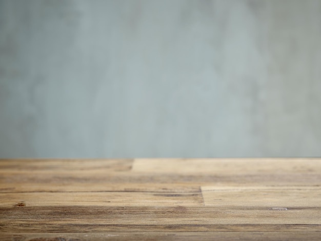 Photo wooden table and grey wall