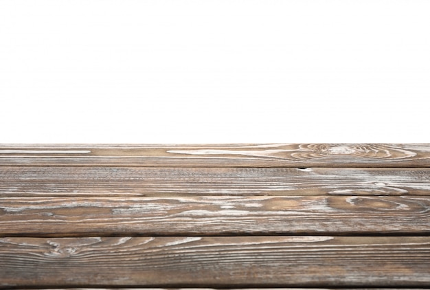 Wooden table surface against white