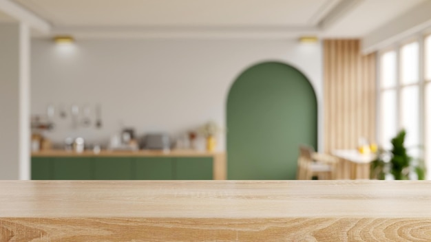 Piano del tavolo in legno su sfondo sfocato cucina moderna interiore contemporaneo della stanza della cucina