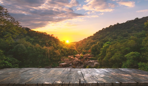 Photo wooden table top and blur nature of the background