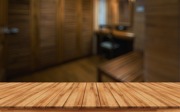 Wooden table top for montage products display with blurred spa interior background