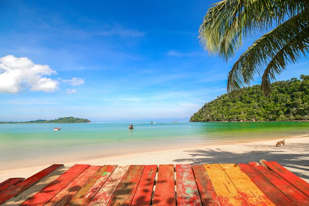 Wooden table top with blurred of beautiful beach nature background